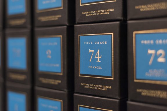True Grace — packaging design True Grace black fragrance boxes with numbered blue labels